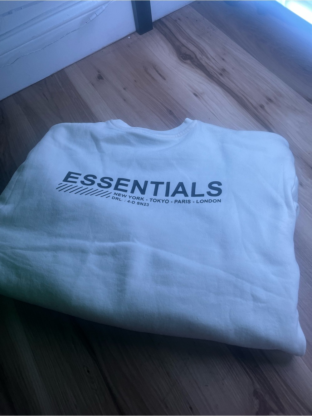 Essentials Crewneck Sweatshirt in White with Black Logo